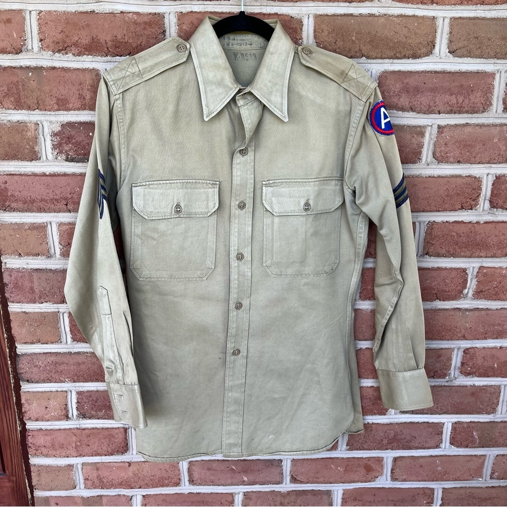 Tan military shirt with army patches. Aprox size Medium mens